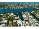 Scenic aerial view of waterfront homes nestled along canals with access to the Gulf and the bay at 807 S Bay Blvd, Anna Maria, FL 34216