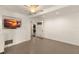 Spacious basement with plank walls, neutral carpet and a television on the wall at 807 S Bay Blvd, Anna Maria, FL 34216