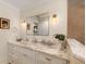 Bright bathroom featuring marble countertop, modern sink, and stylish fixtures, providing a clean and sophisticated look at 807 S Bay Blvd, Anna Maria, FL 34216