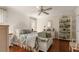 Comfortable bedroom with wicker furniture, ceiling fan, and soft lighting, creating a tranquil retreat at 807 S Bay Blvd, Anna Maria, FL 34216