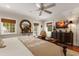 Airy bedroom showcases natural light, ceiling fan, dresser, and warm decor, creating a welcoming space at 807 S Bay Blvd, Anna Maria, FL 34216