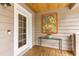 Charming entryway with front door, art, and a glass topped table, offering a warm welcome at 807 S Bay Blvd, Anna Maria, FL 34216