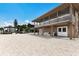 Spacious lower level of waterfront home features comfortable seating, ceiling fans, and convenient access to the water at 807 S Bay Blvd, Anna Maria, FL 34216