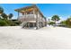 Lovely stilt home with a covered balcony and entertainment area underneath, perfect for waterfront living at 807 S Bay Blvd, Anna Maria, FL 34216
