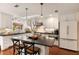 Bright kitchen with white cabinets, stainless steel appliances, and a center island perfect for entertaining at 807 S Bay Blvd, Anna Maria, FL 34216