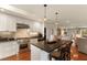 Modern kitchen featuring a central island, stainless steel appliances, and sleek countertops at 807 S Bay Blvd, Anna Maria, FL 34216