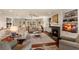Spacious living room with fireplace, ceiling fan, and hardwood floors, creating a welcoming atmosphere at 807 S Bay Blvd, Anna Maria, FL 34216