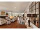 Spacious living room with a fireplace, open floor plan, and hardwood flooring at 807 S Bay Blvd, Anna Maria, FL 34216