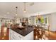 Open-concept living space connecting the kitchen, living room, and dining area at 807 S Bay Blvd, Anna Maria, FL 34216