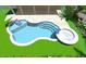 Swimming pool with jacuzzi, ample seating, manicured lawn, and lush tropical landscaping at 807 S Bay Blvd, Anna Maria, FL 34216