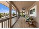 Relaxing porch with comfortable seating and view of boats in the water at 807 S Bay Blvd, Anna Maria, FL 34216