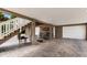 Outdoor living space under deck with brick flooring, rocking chairs, and access to the garage at 807 S Bay Blvd, Anna Maria, FL 34216