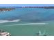 Expansive waterfront view with blue water, boats, a distant city skyline, and a bridge in the background at 810 Siesta Dr, Sarasota, FL 34242