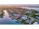 Gorgeous aerial view of upscale waterfront neighborhood featuring stunning homes and boat docks along the canals at 810 Siesta Dr, Sarasota, FL 34242