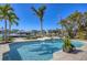Enjoy this tranquil backyard oasis with a sparkling pool, lush landscaping and direct waterfront access for boating at 810 Siesta Dr, Sarasota, FL 34242