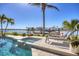 Enjoy resort-style living with a stunning pool, spa, and waterfront access, creating the perfect backyard retreat at 810 Siesta Dr, Sarasota, FL 34242