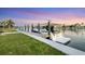 Beautiful boat and dock with waterfront access, perfect for boating enthusiasts and enjoying the water at 810 Siesta Dr, Sarasota, FL 34242