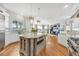 Spacious kitchen with a large island, stainless steel appliances, and hardwood flooring at 810 Siesta Dr, Sarasota, FL 34242