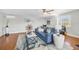 Living room featuring nautical accents, light wood floors and comfortable seating at 810 Siesta Dr, Sarasota, FL 34242