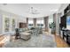 Bright living room with comfortable seating, large windows, and lovely outdoor views at 810 Siesta Dr, Sarasota, FL 34242