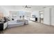 Spacious main bedroom with carpet, a waterfront view, and a comfortable seating area at 810 Siesta Dr, Sarasota, FL 34242