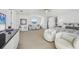 Spacious main bedroom featuring a sitting area, large window, and ample natural light at 810 Siesta Dr, Sarasota, FL 34242