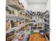 Spacious pantry features ample shelving and storage space for food and kitchen essentials at 810 Siesta Dr, Sarasota, FL 34242