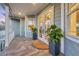 Beautiful porch with tile flooring, a covered ceiling, and charming outdoor decor at 810 Siesta Dr, Sarasota, FL 34242