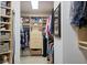 Organized walk-in closet with custom shelving and ample storage space for clothing and accessories at 810 Siesta Dr, Sarasota, FL 34242