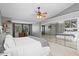 Spacious bedroom featuring mirrored closet doors, neutral walls, and abundant natural light at 820 Faulkwood Ct, Sarasota, FL 34232