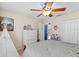 Cozy bedroom with ceiling fan, neutral walls, and a closet for storage at 820 Faulkwood Ct, Sarasota, FL 34232