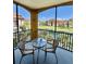 Private balcony view of lush landscaping and a lake providing the perfect peaceful outdoor area at 8351 38Th Street E Cir # 302, Sarasota, FL 34243
