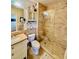 Updated bathroom featuring a glass-enclosed shower, tile walls, and a modern vanity at 8351 38Th Street E Cir # 302, Sarasota, FL 34243