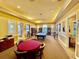 A community common room with a pool table and seating provides areas for residents to gather at 8351 38Th Street E Cir # 302, Sarasota, FL 34243