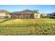Spacious, well-maintained backyard featuring a screened patio, perfect for entertaining and relaxation at 11021 Moonsail Dr, Parrish, FL 34219