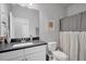 Simple bathroom featuring a sleek vanity with stone countertop, framed mirror, and neutral color palette at 11021 Moonsail Dr, Parrish, FL 34219