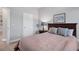 Comfortable bedroom featuring wood furnishings and soft color palette at 11021 Moonsail Dr, Parrish, FL 34219