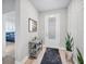 Bright entryway featuring stylish decor, a decorative rug, and a frosted glass front door at 11021 Moonsail Dr, Parrish, FL 34219
