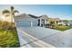 A lovely home boasting a spacious driveway, manicured lawn, and welcoming curb appeal at 11021 Moonsail Dr, Parrish, FL 34219