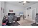 Well-lit home office with dual monitors, neutral walls, and glass paneled doors to adjacent room at 11021 Moonsail Dr, Parrish, FL 34219
