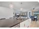 Open kitchen featuring a spacious island, stainless steel appliances, and pendant lighting at 11021 Moonsail Dr, Parrish, FL 34219