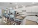Bright, open-concept kitchen with large island, modern cabinets, and stainless steel appliances at 11021 Moonsail Dr, Parrish, FL 34219