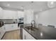Bright kitchen features a large island, white cabinets, and stainless steel appliances at 11021 Moonsail Dr, Parrish, FL 34219