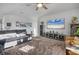 Spacious living room with comfortable seating, a large TV, and stylish decor at 11021 Moonsail Dr, Parrish, FL 34219