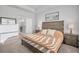 Cozy main bedroom featuring neutral color scheme and a full en suite bathroom at 11021 Moonsail Dr, Parrish, FL 34219