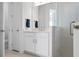 Well-lit bathroom featuring a modern shower, single vanity sink, and contemporary fixtures at 11522 Trivio Ter, Palmetto, FL 34221