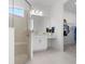 Modern bathroom featuring a glass-enclosed shower, a vanity with drawers, and a walk-in closet at 11522 Trivio Ter, Palmetto, FL 34221