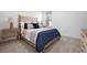 Comfortable bedroom featuring a large bed with stylish bedding, side tables and lamps at 11522 Trivio Ter, Palmetto, FL 34221