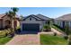 Charming single-Gathering home with a well-manicured lawn and inviting paver driveway at 11522 Trivio Ter, Palmetto, FL 34221