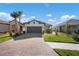 Charming single-story home with a tile roof, brick paver driveway, and well-maintained landscaping at 11522 Trivio Ter, Palmetto, FL 34221